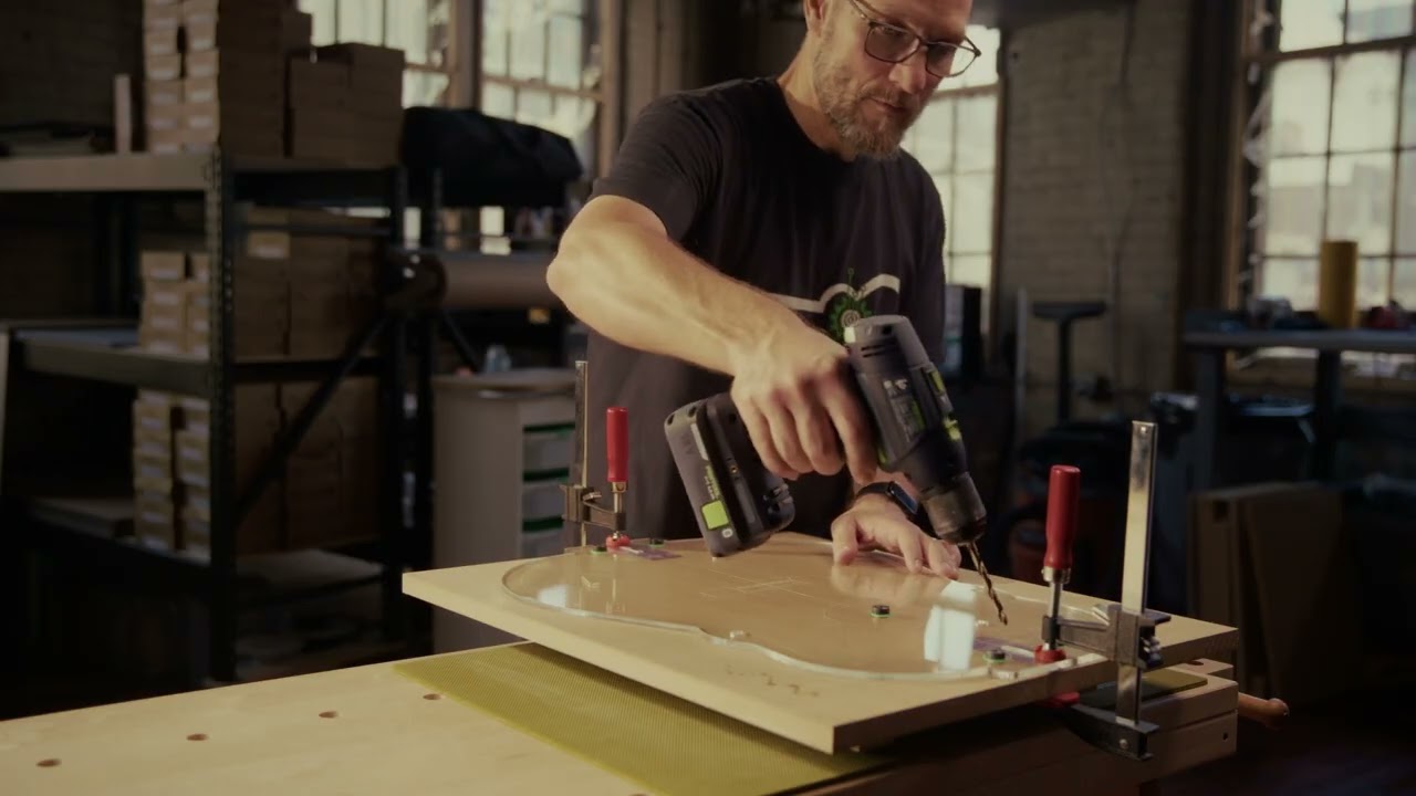 Drilling the soundboard and back plates on the reference system